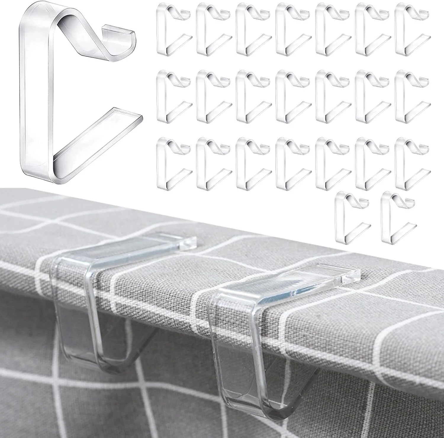 clear acrylic C shaped tablecloth clips holding down the edge of a grey tablecloth on a narrow 1" tabletop